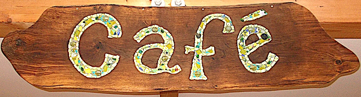 Cafe mosaic sign recessed into hardwood